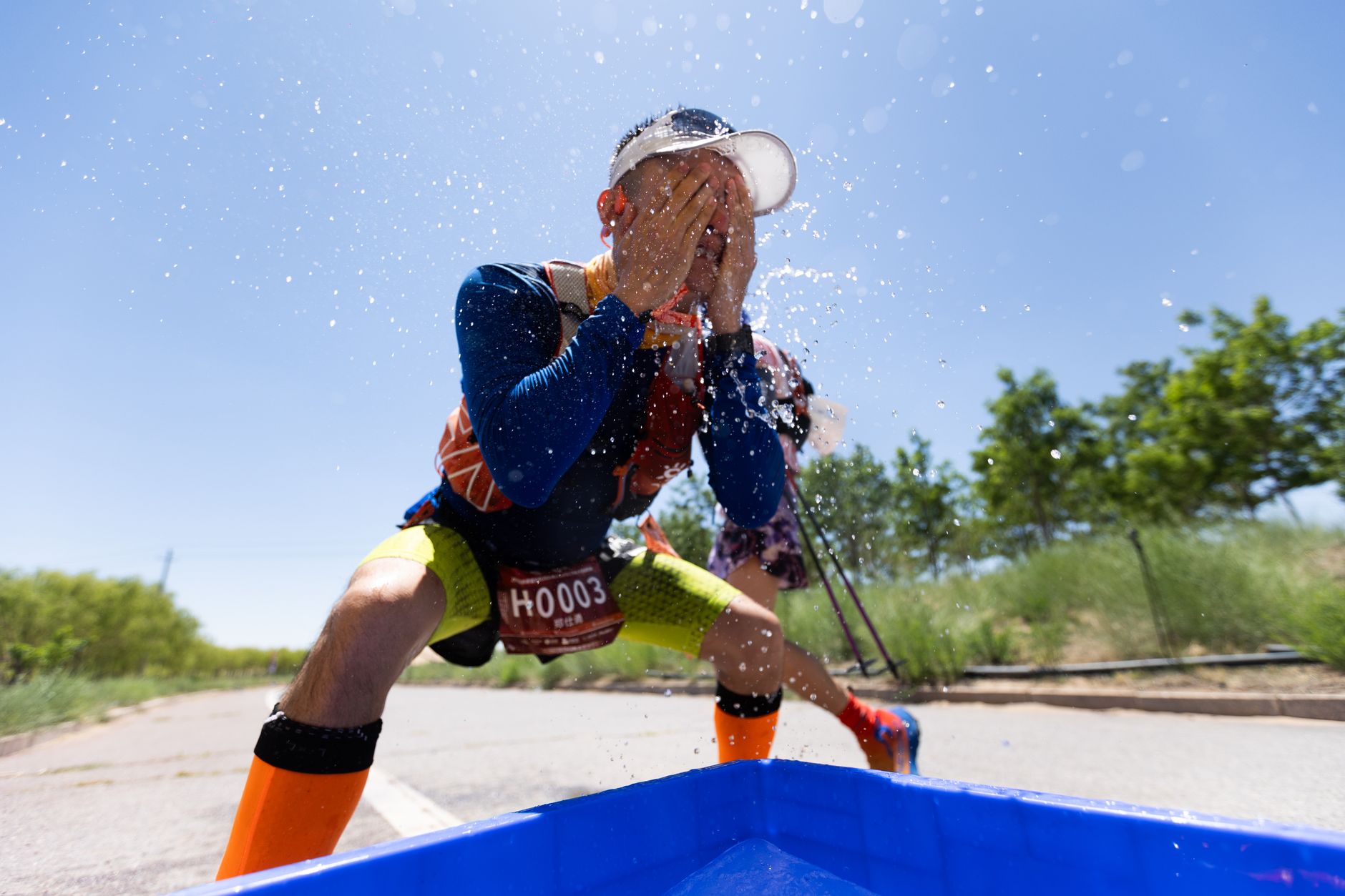 How should you adjust your running training for hot weather?