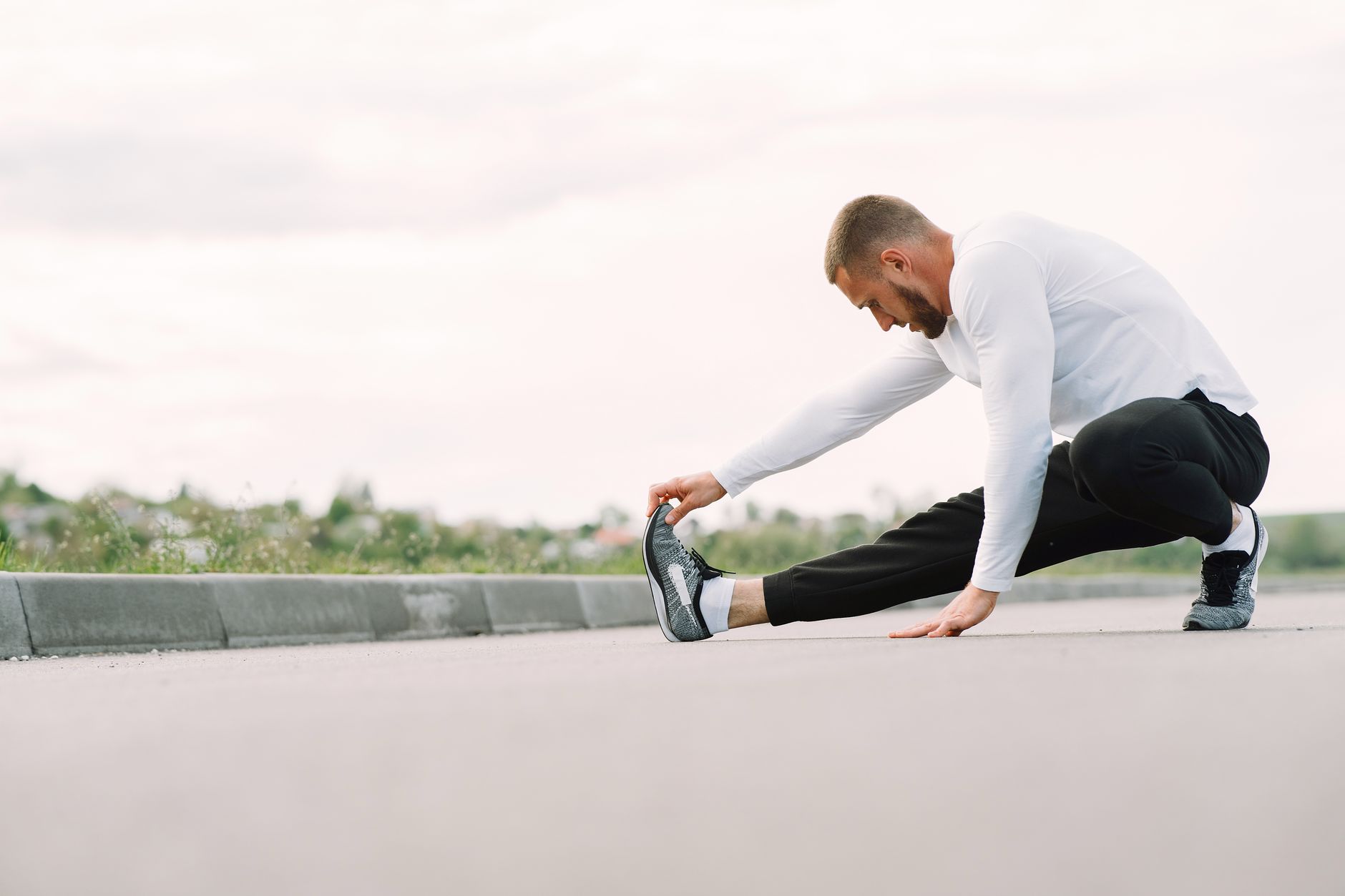 How should runners over 40 adjust training to stay fast and healthy?